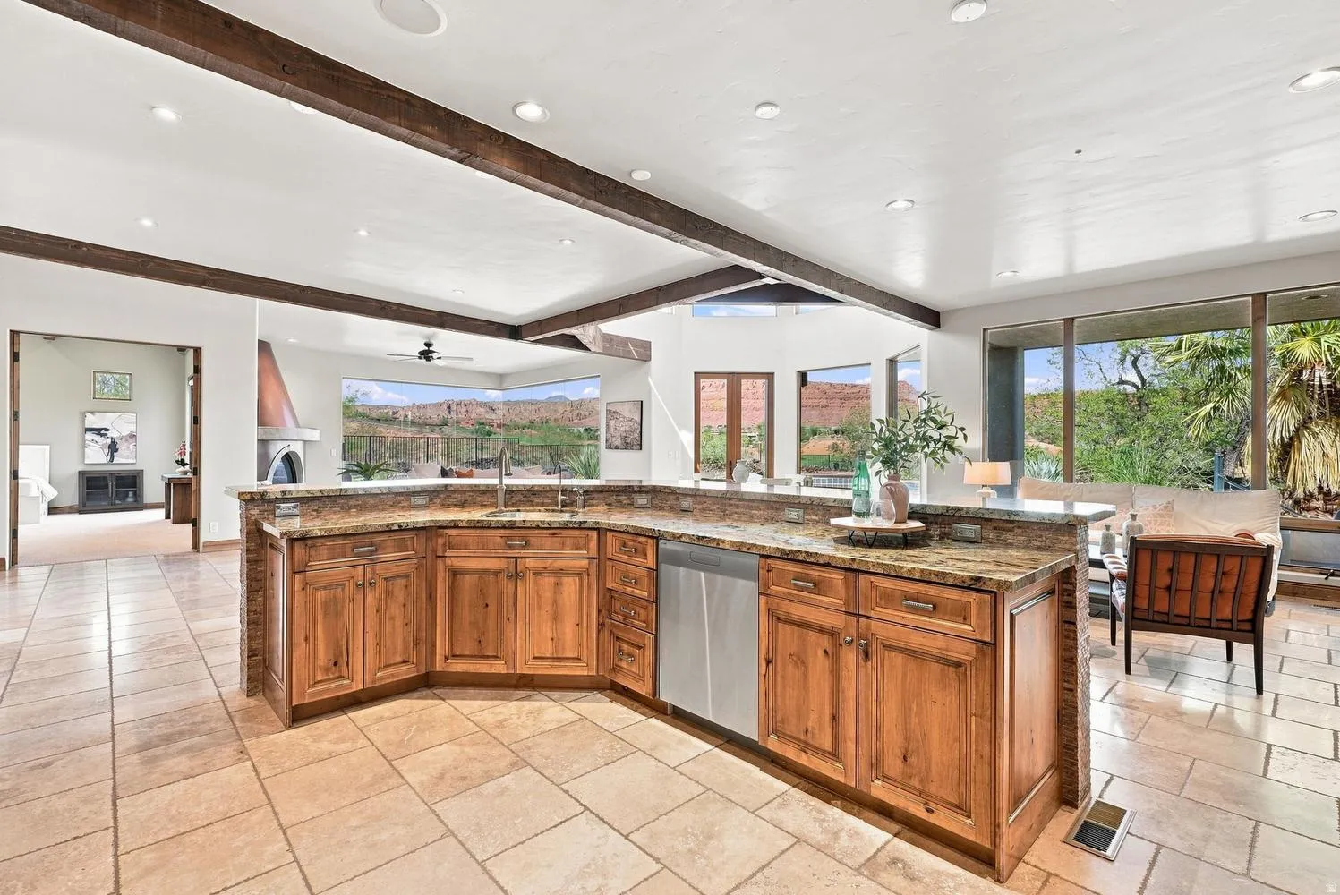 Expansive kitchen island with wood-finish cabinetry and stone countertops
