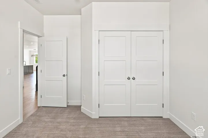 Neutral-toned carpet flooring complementing white walls