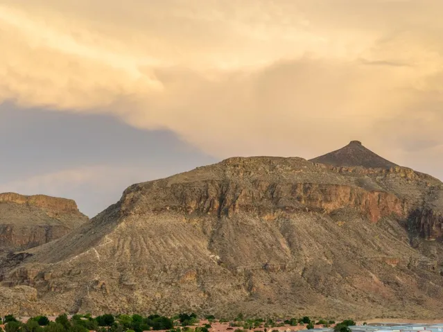 Mountain backdrop with rugged terrain and natural rock formations