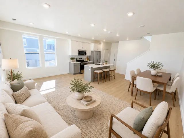 Open-concept living space with recessed lighting, wood-finish flooring, and multiple windows