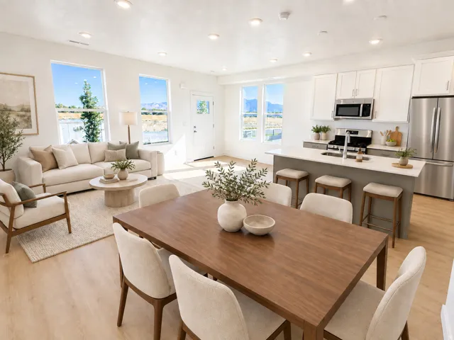 Open-concept living area with wood-finish flooring