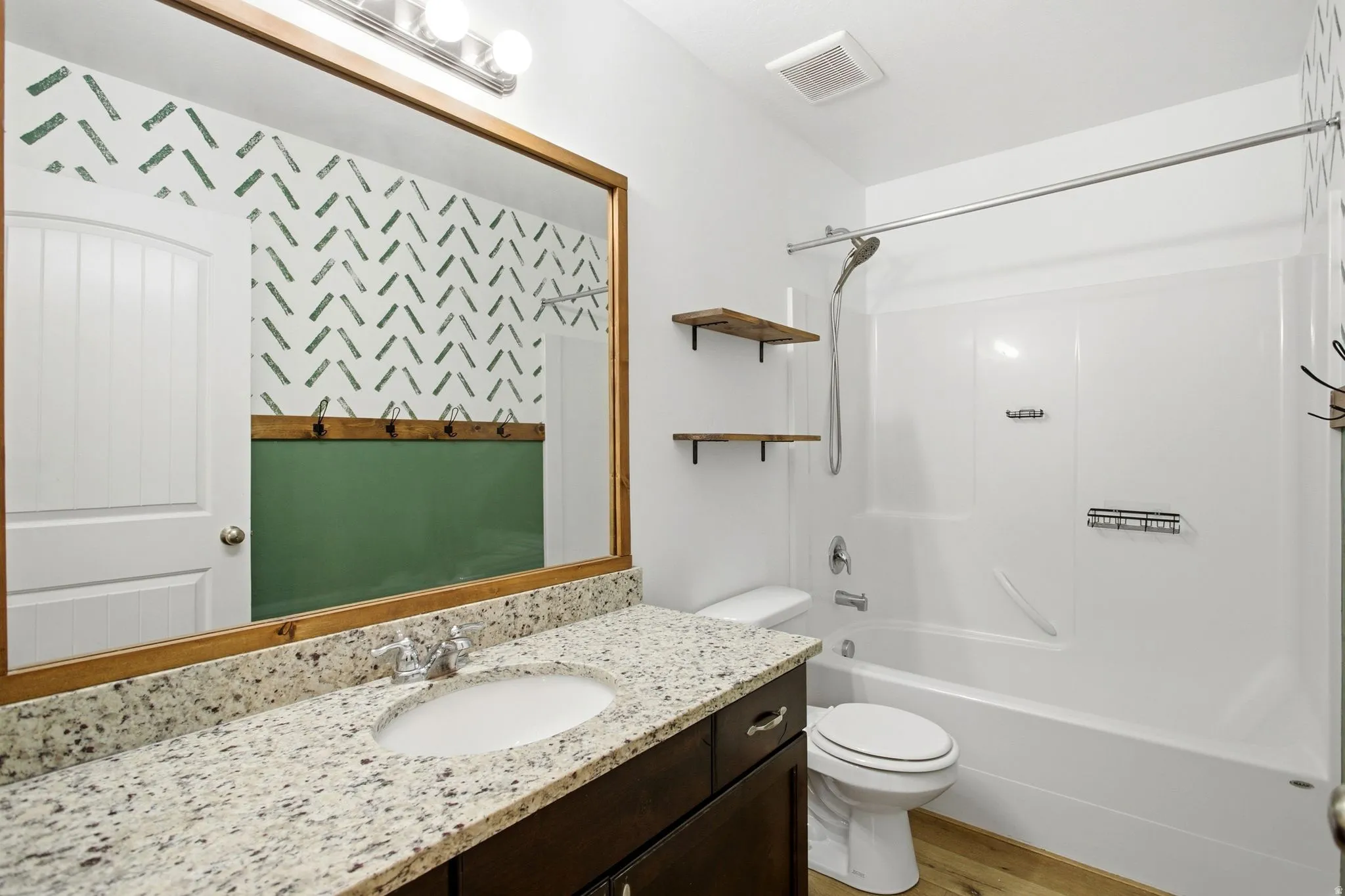 Main floor bathroom with large vanity.
