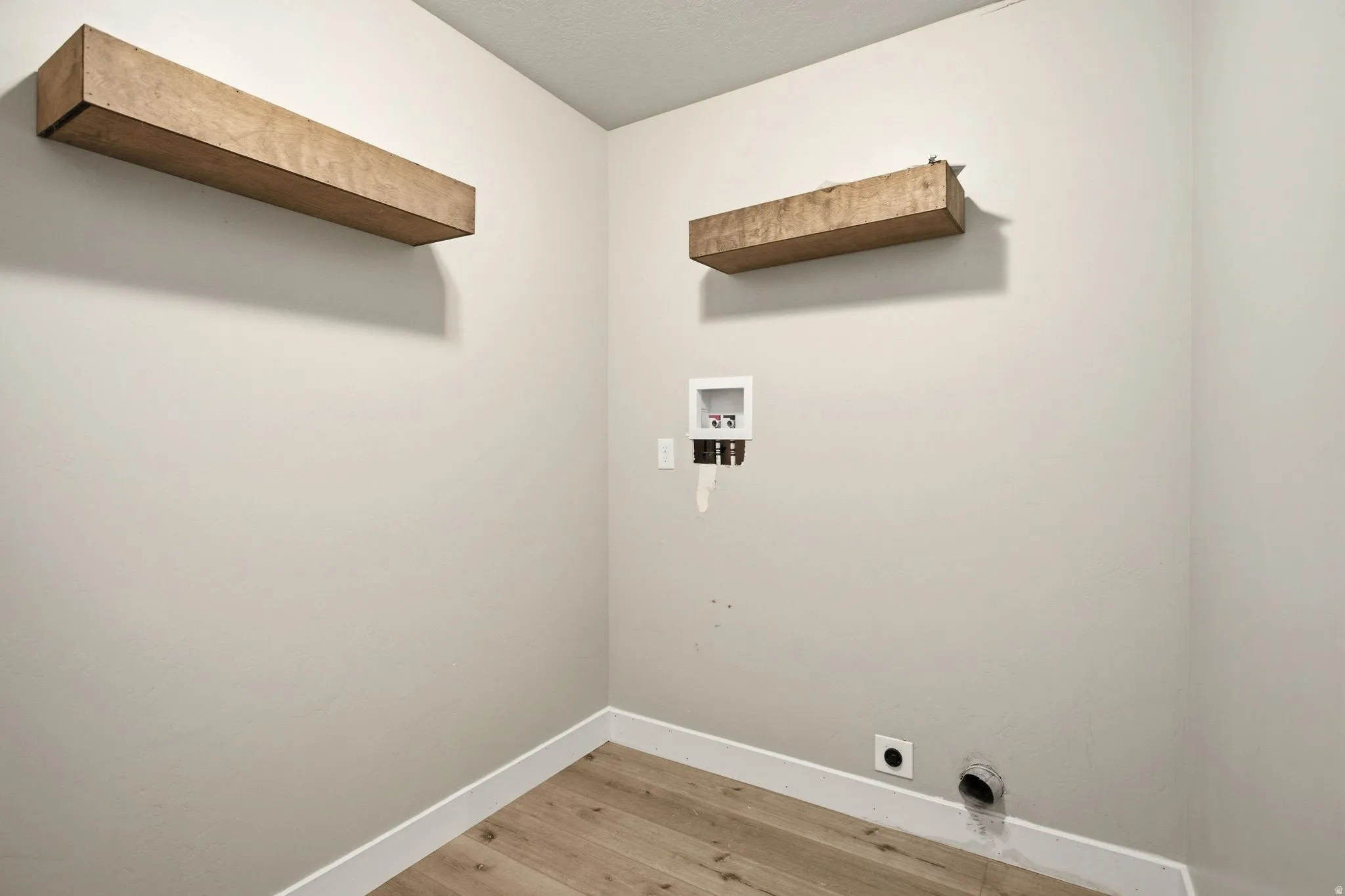 Main floor laundry room located right by the bedrooms.