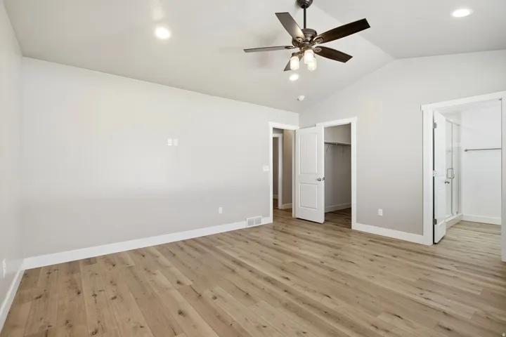 Primary bedroom with ensuite bathroom and walk-in closet.