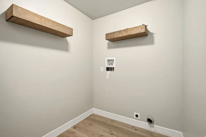 Main floor laundry room located right by the bedrooms.