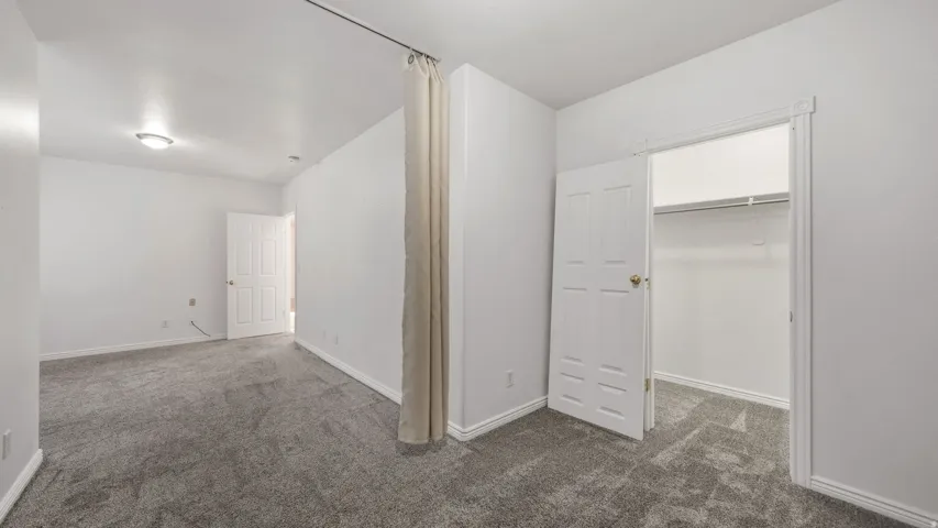 Textured gray carpeting throughout