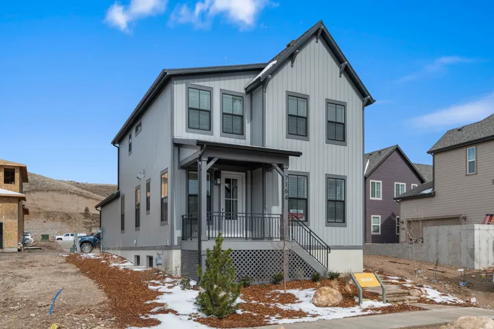 Modern two-story residence with vertical siding and contrasting trim