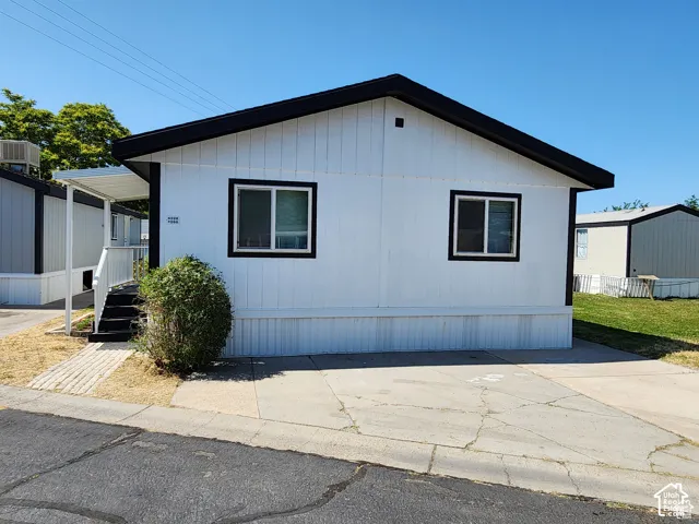 White exterior siding with contrasting black trim