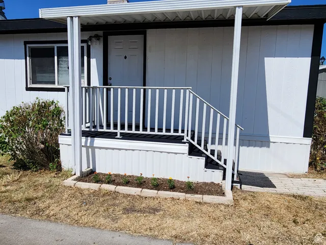 White horizontal siding exterior with black trim accents