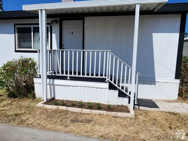 White horizontal siding exterior with black trim accents