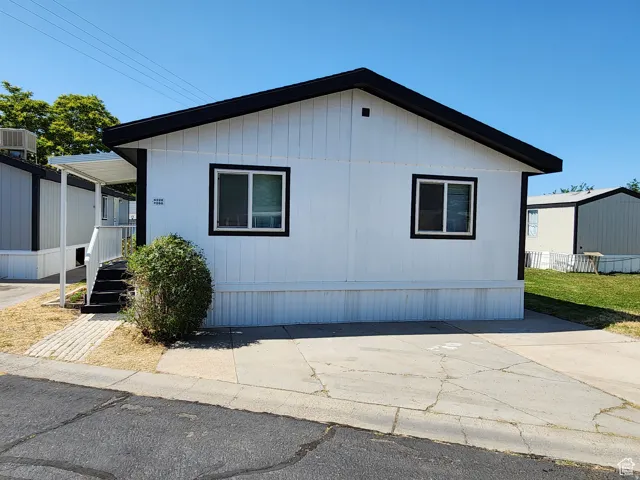 White exterior siding with contrasting black trim