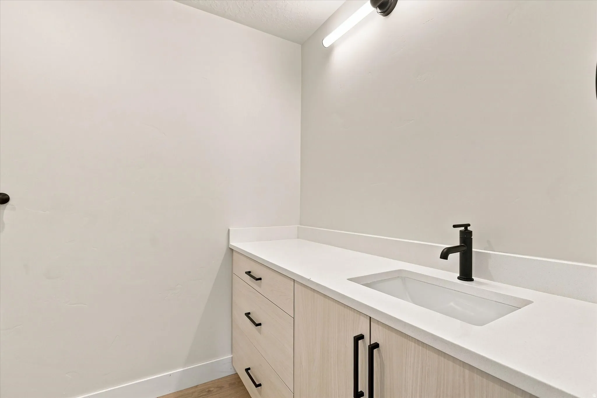 Light wood-finish vanity with ample storage