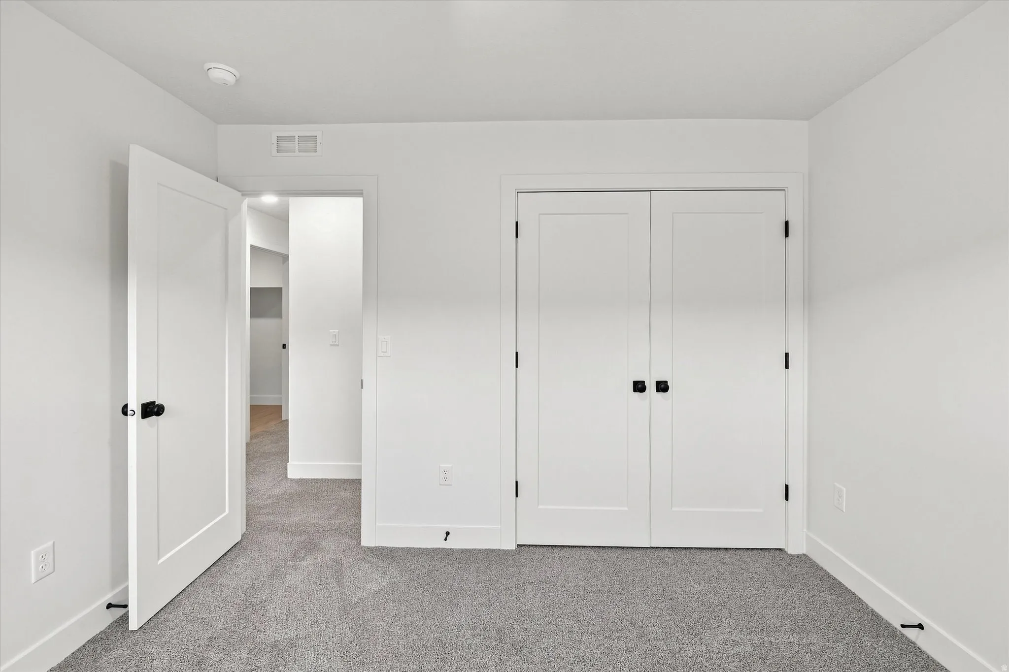 Neutral color palette with light gray carpeting