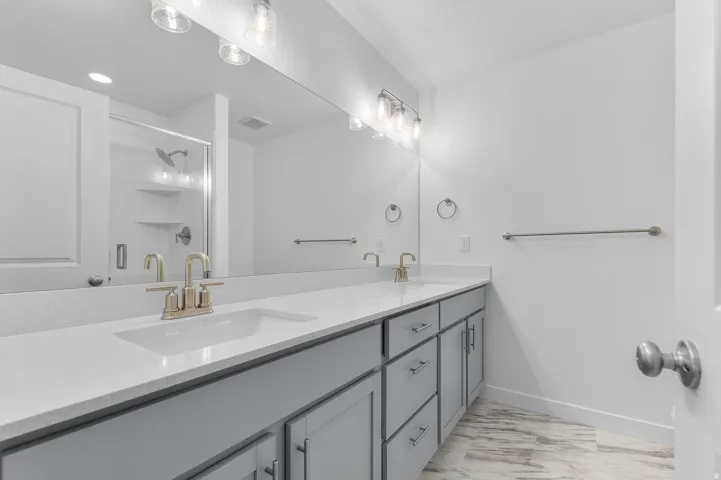 Dual vanity with stone-finish countertop and undermount sinks