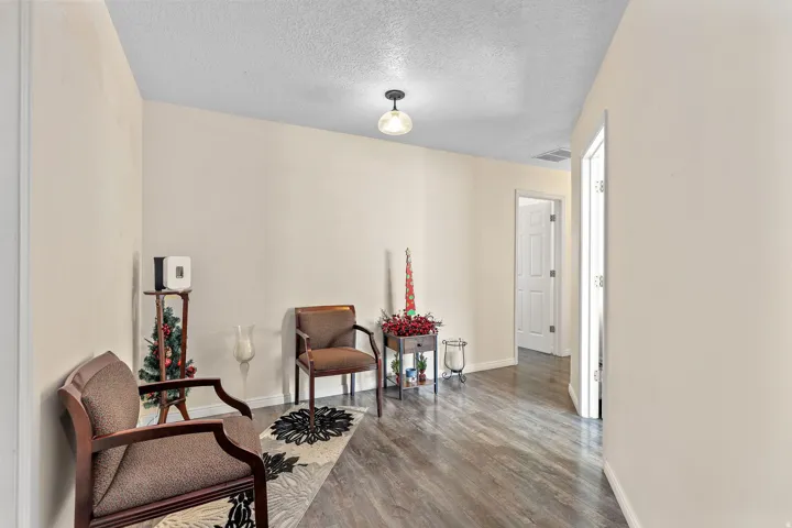 Wood-finish flooring throughout the space