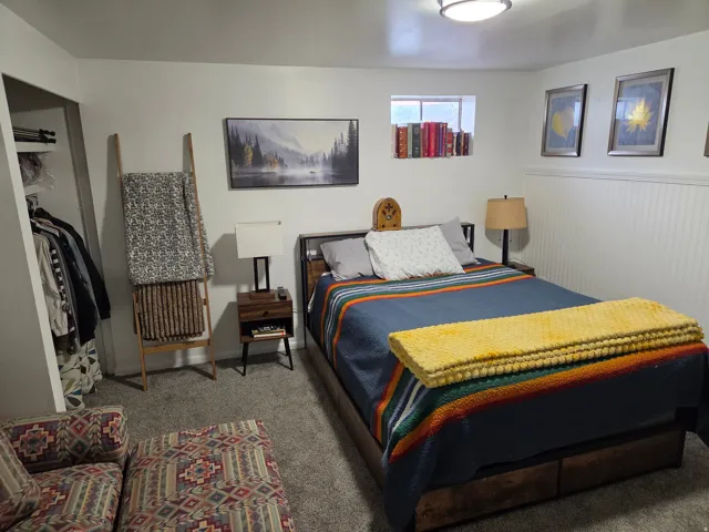 Carpeted flooring, beadboard wainscoting, recessed window, and flush-mount ceiling light