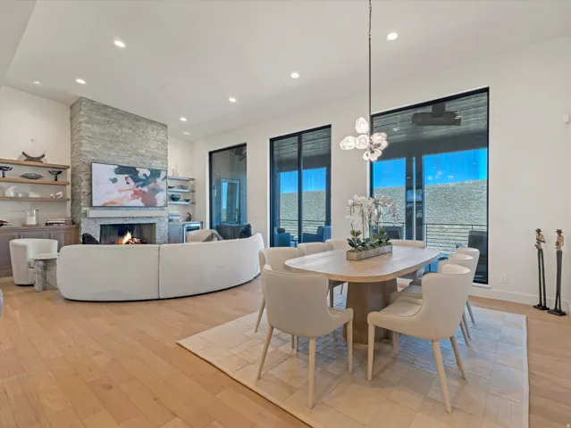 Open-concept living area with wood-finish flooring