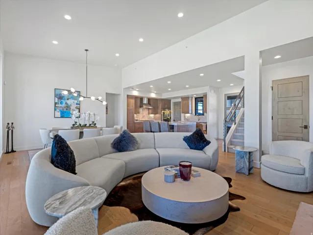 Hardwood-finish flooring throughout, recessed lighting, and a modern open-concept design