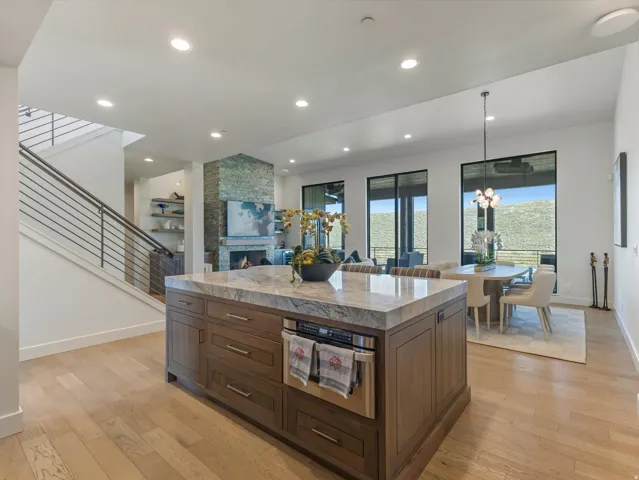 Spacious open-concept interior with wood-finish flooring