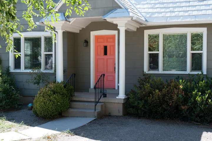 Front facade with gray siding and white trim