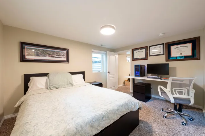 Neutral-toned walls complement the carpeted flooring