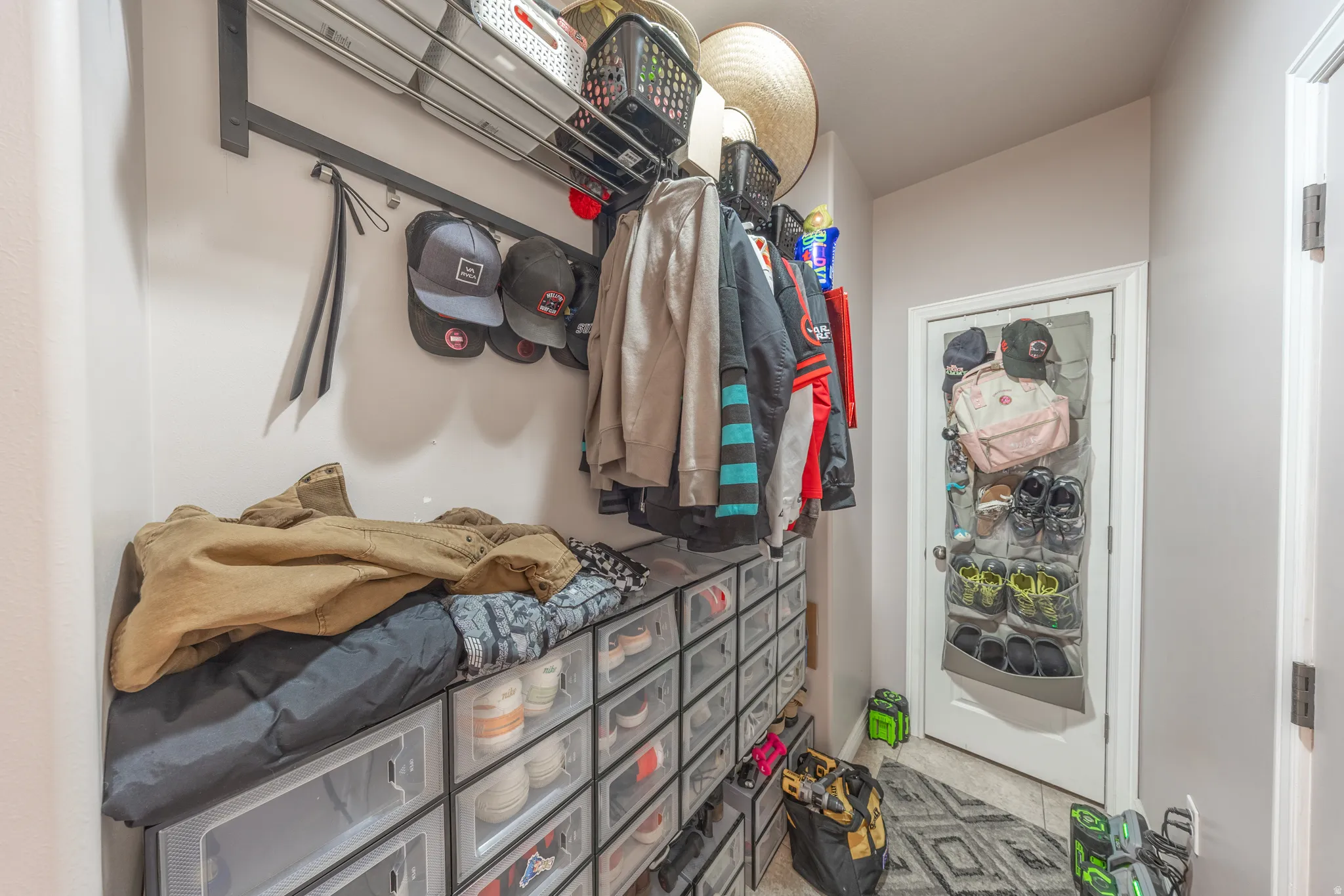Convenient mudroom located just off the kitchen and adjacent to the garage entry, providing a practical drop zone with plenty of space for organized storage.