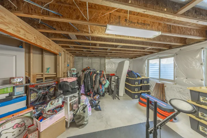Expansive unfinished basement with framing, insulation, electrical, and HVAC already in place, offering excellent potential for future bedrooms, recreation space, a home gym, or additional storage.