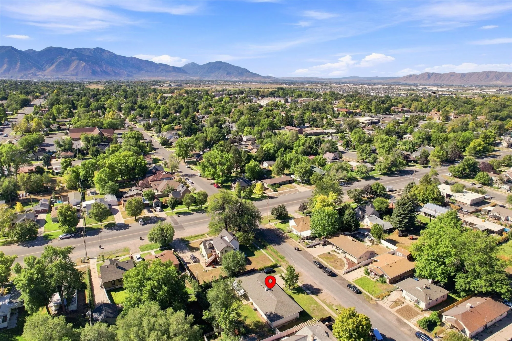 Expansive neighborhood with abundant mature trees and distant mountain ranges
