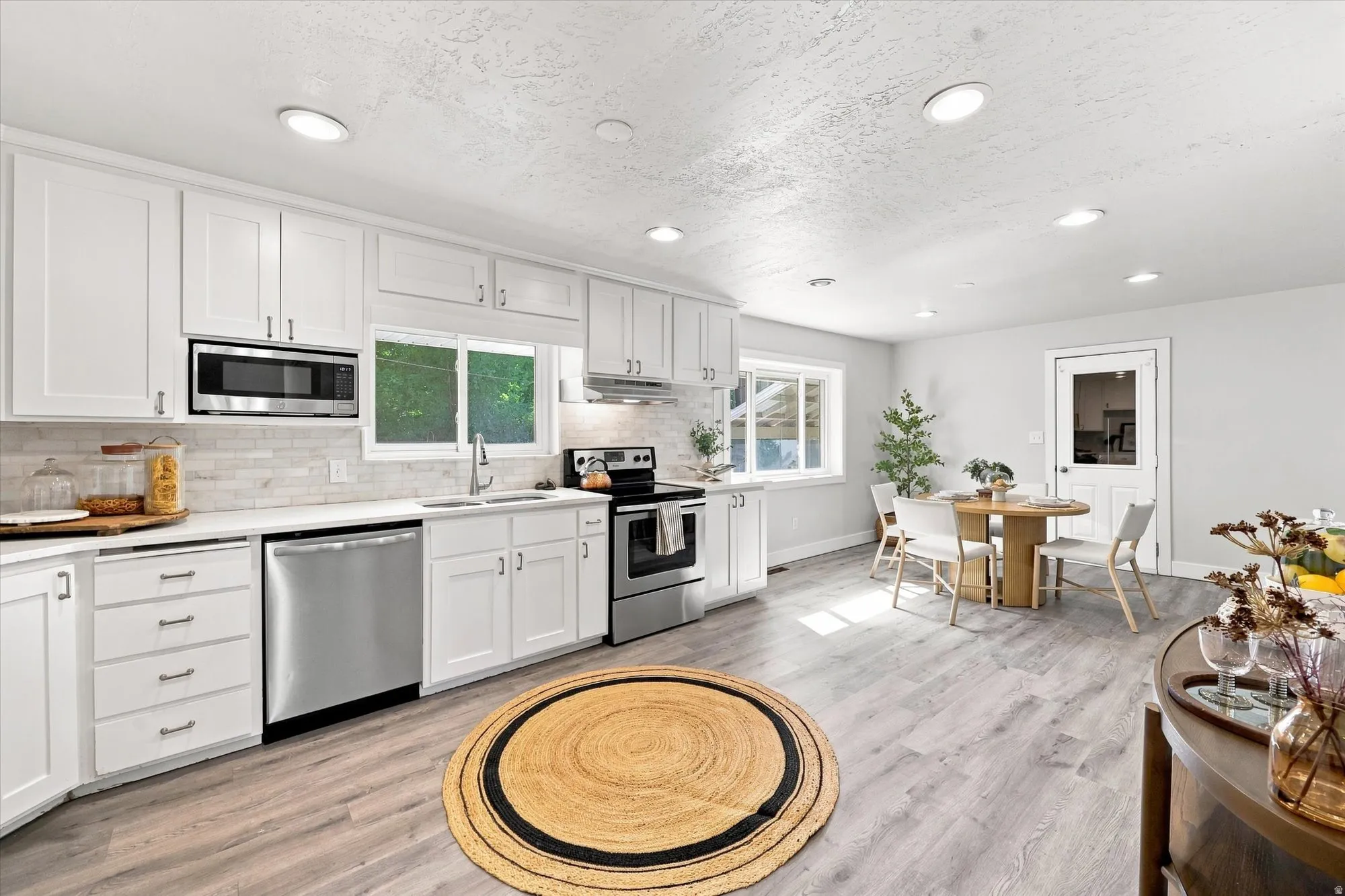 White shaker cabinetry and stainless steel appliances