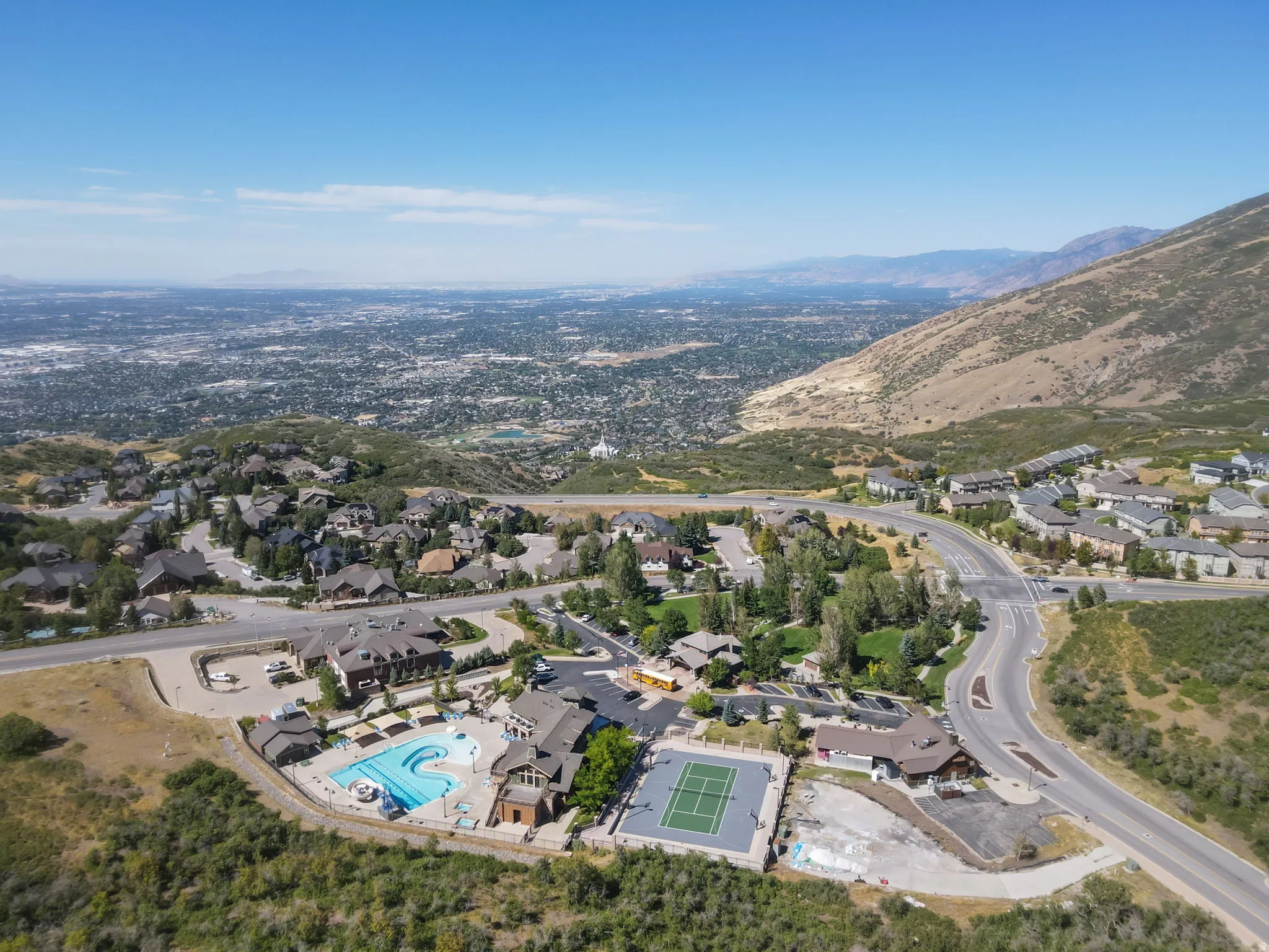 Community amenities including a swimming pool, tennis court, and clubhouse