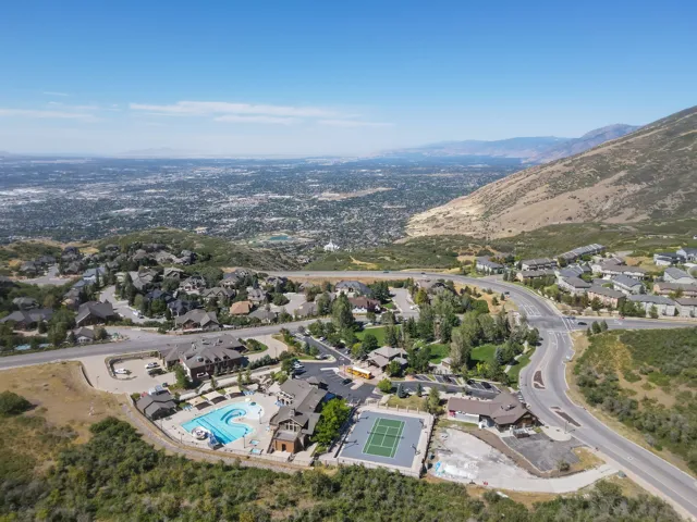 Community amenities including a swimming pool, tennis court, and clubhouse