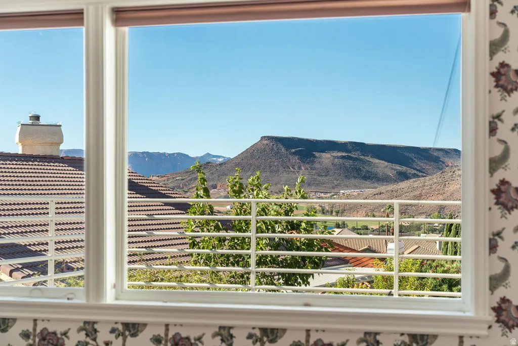 Double-pane window offering expansive mountain scenery