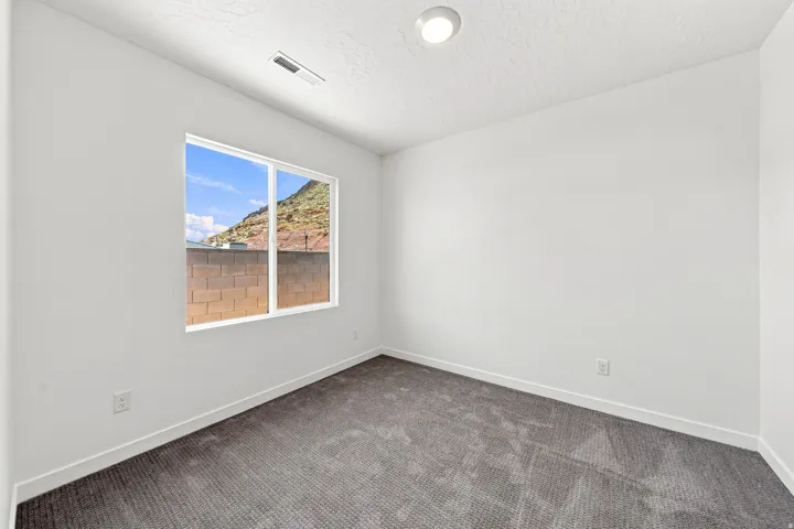 Neutral white walls with a mounted ceiling light
