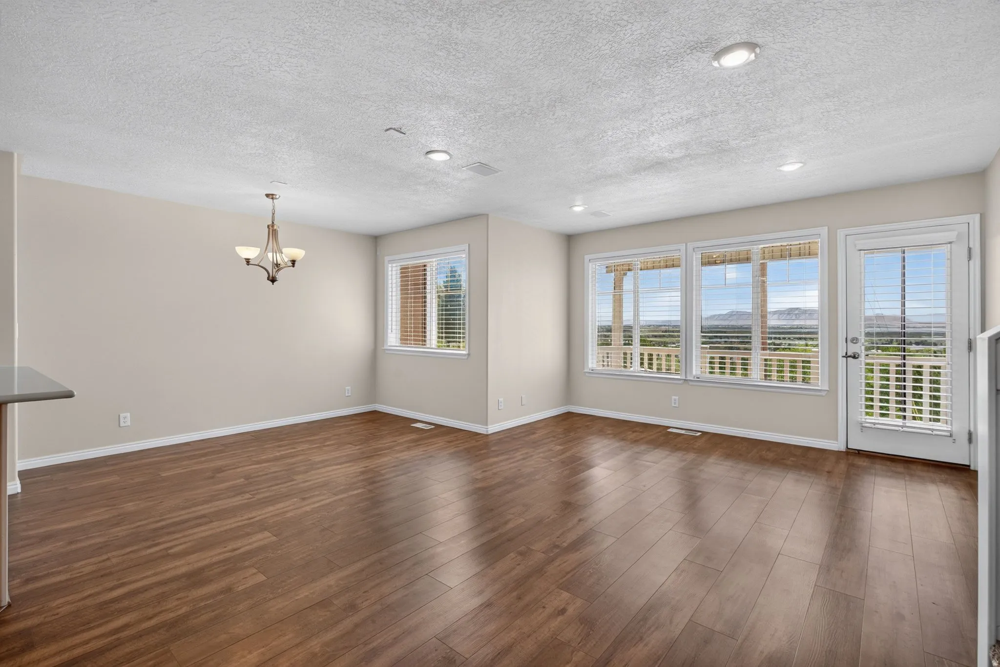 Wood-finish flooring throughout, with a door providing exterior access
