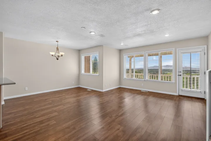 Wood-finish flooring throughout, with a door providing exterior access