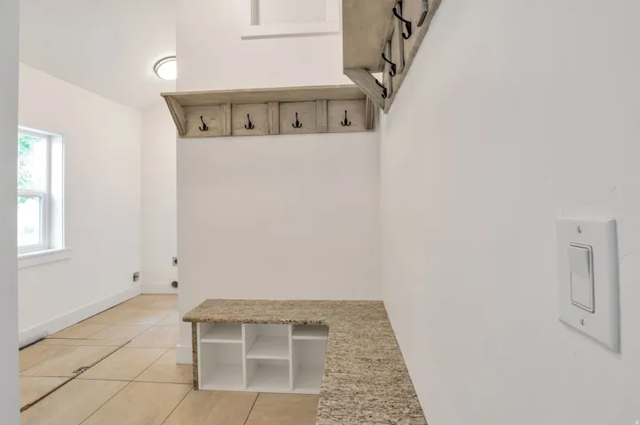 Built-in storage bench with an integrated shelving unit and a durable countertop