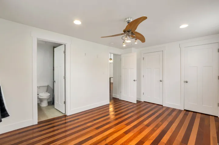 Hardwood flooring, recessed lighting, and a ceiling fan with integrated lighting