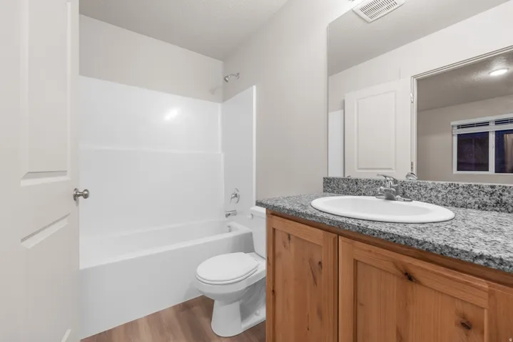 White built-in bathtub and shower combination