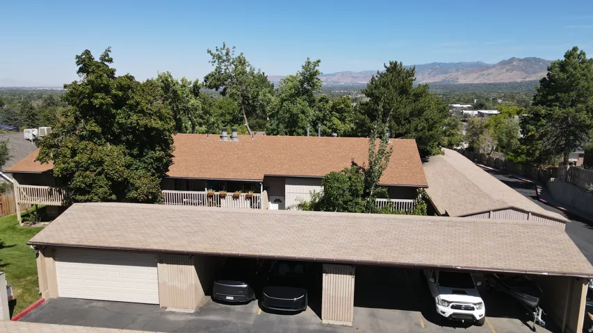 Covered parking (the empty spot) with a locked storage area.