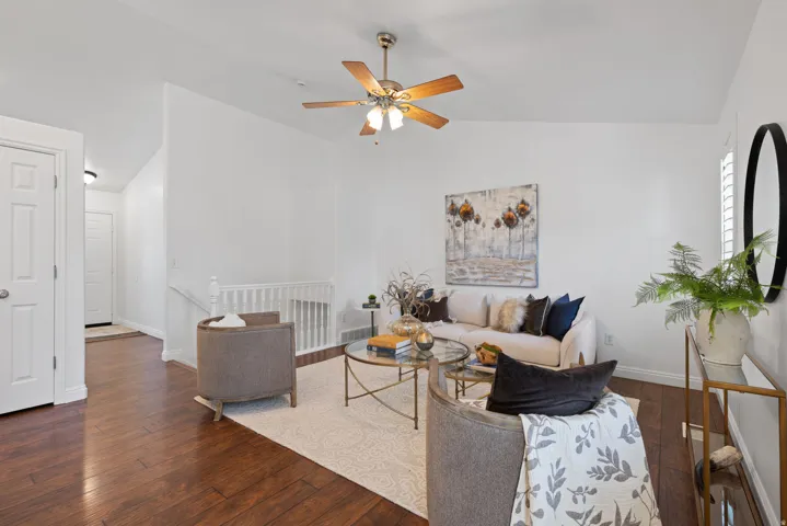 Wood-finish flooring throughout, complemented by white walls