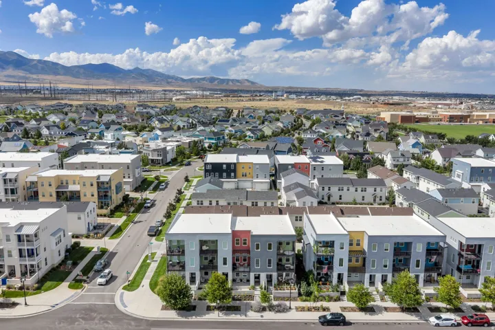 Residential community featuring a variety of housing styles, established streets, and surrounding mountainous terrain