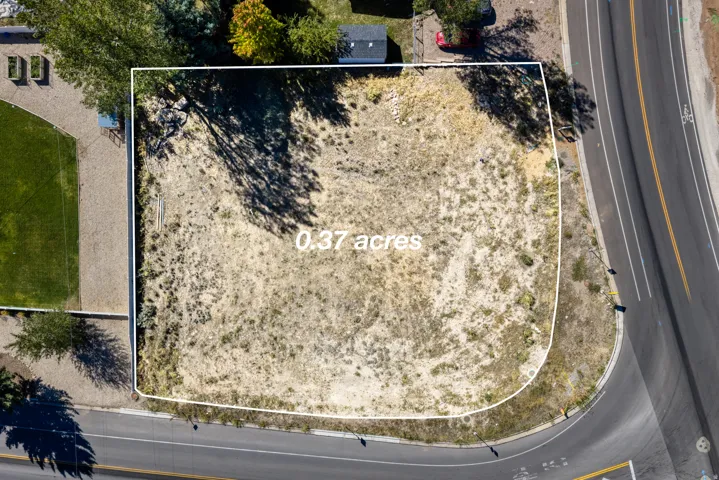 0.37-acre undeveloped lot featuring natural vegetation and street frontage