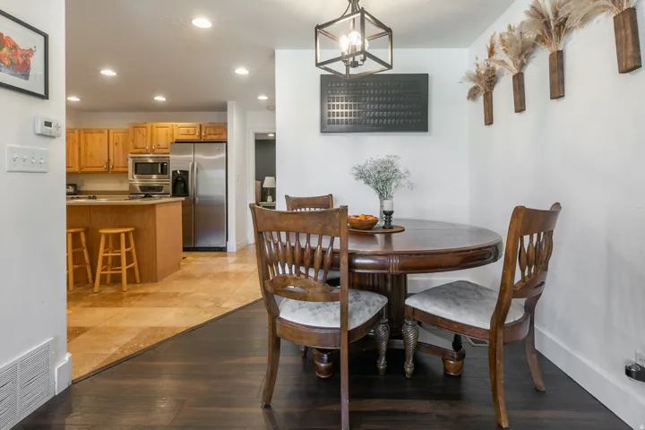 Kitchen with wood cabinetry, stainless steel appliances, and recessed lighting