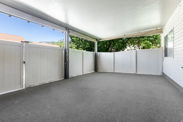 Covered outdoor patio with a gray concrete surface