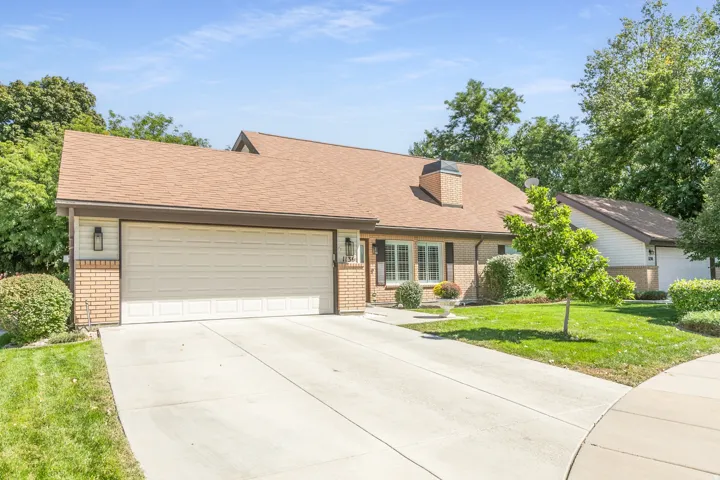 Brick and siding exterior with a two-car garage