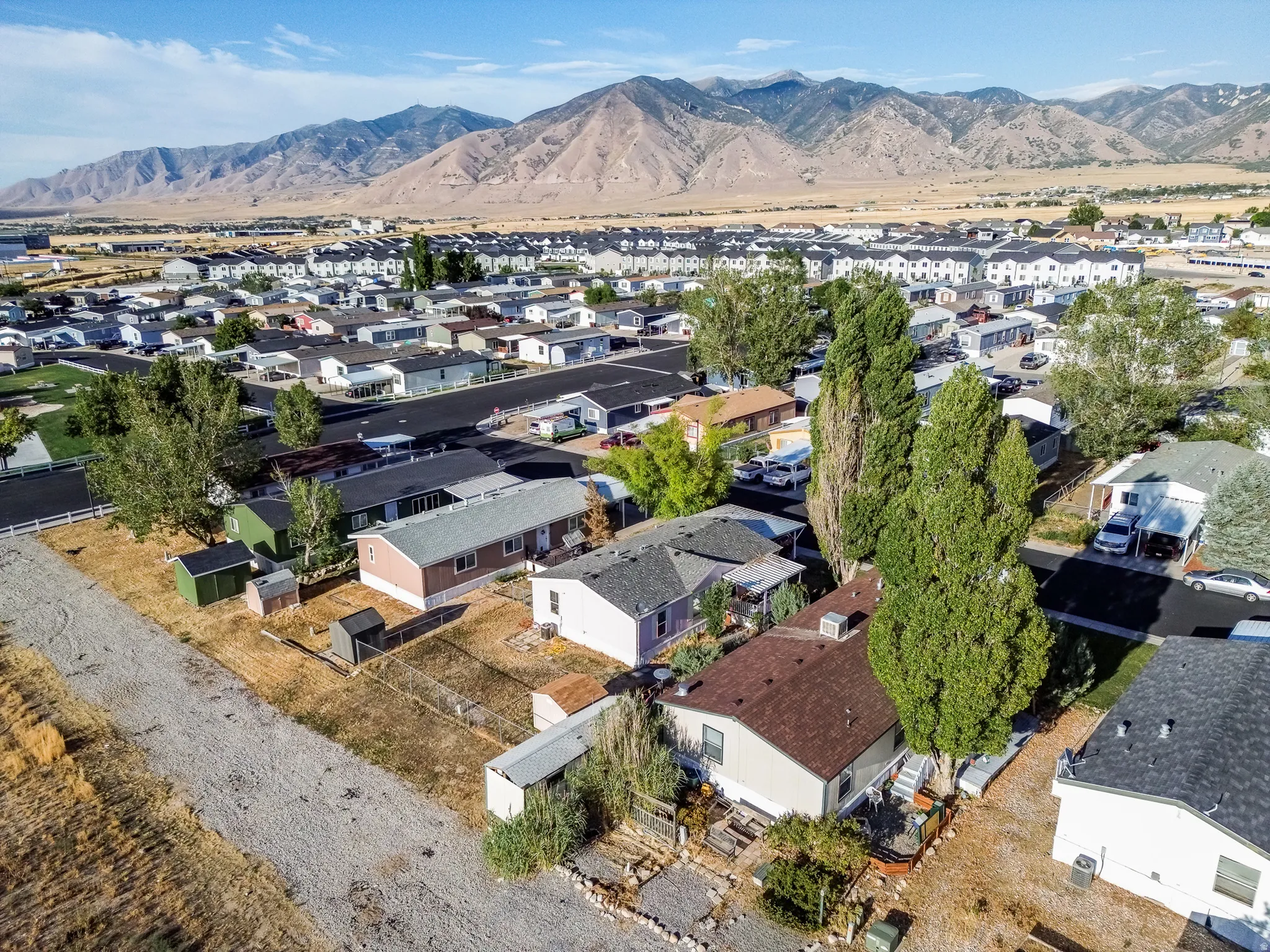 Mountain backdrop with residential properties and varied rooflines
