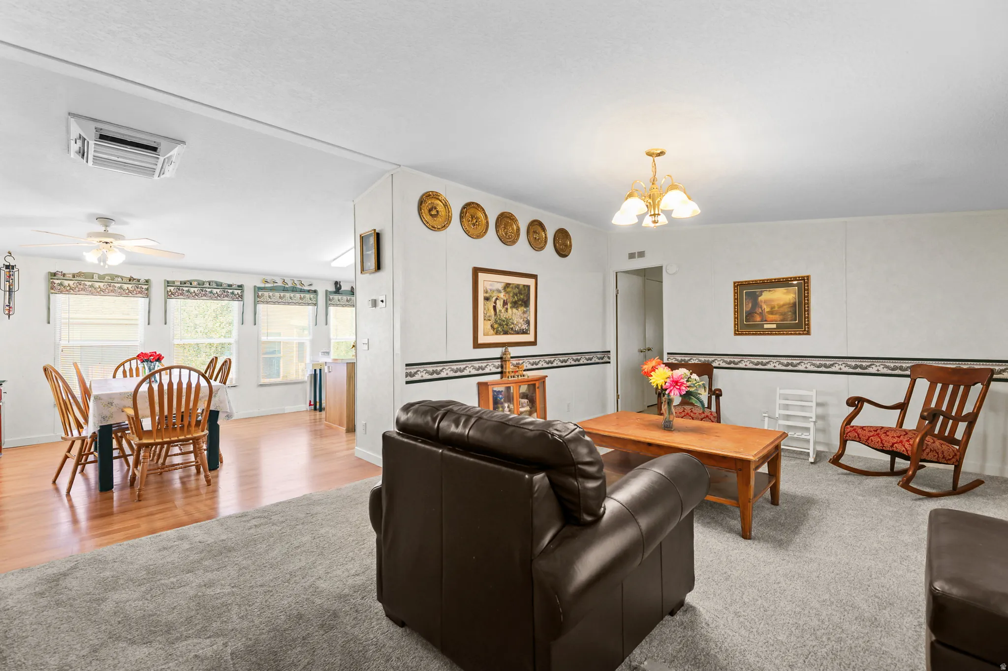 Open concept living area with carpeted flooring