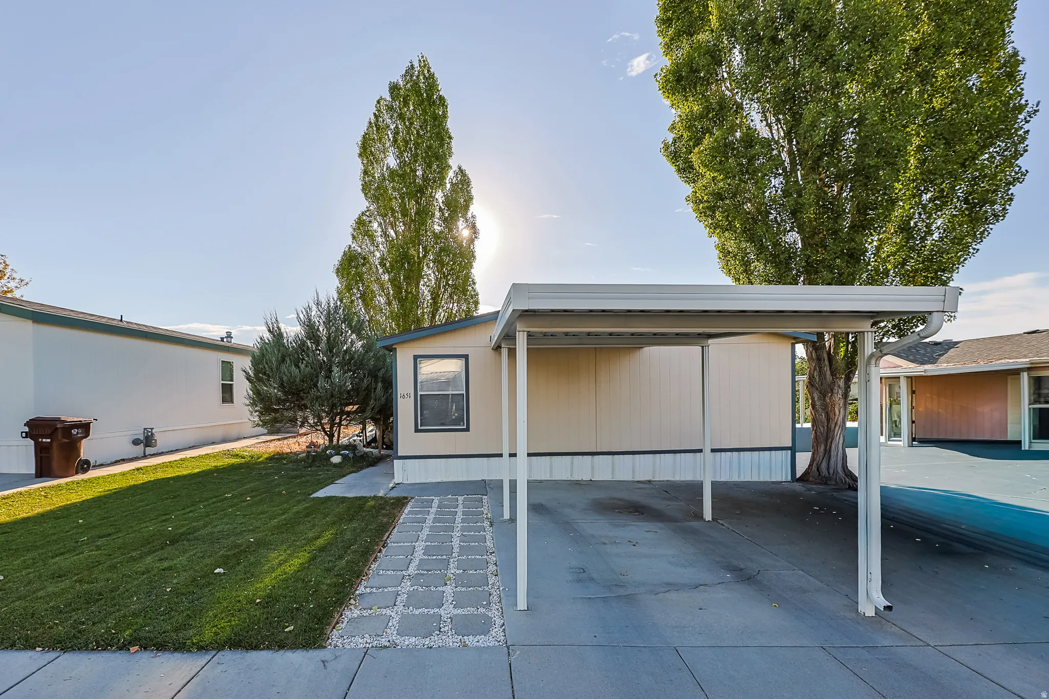 Integrated carport with a concrete driveway