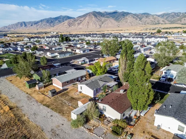 Mountain backdrop with residential properties and varied rooflines