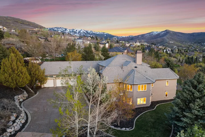 Multi-level residence with a tile roof and stucco exterior